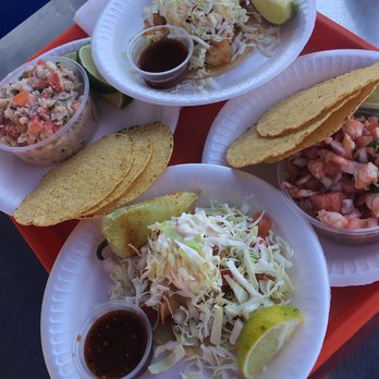 Fish ceviche, shrimp ceviche, one shrimp taco and one fish taco