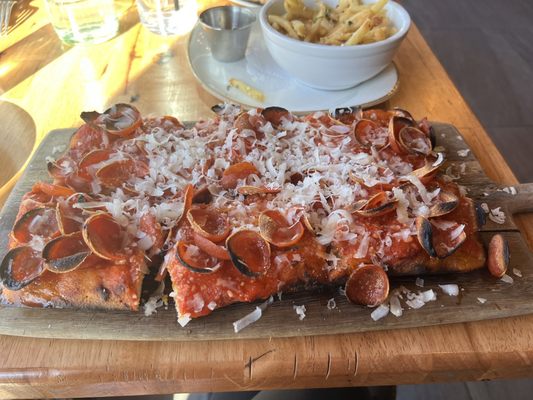 Photo of Wood & Fire Neapolitan Style Pizza - Pleasantville, NY, US. a pizza with pepperoni and cheese