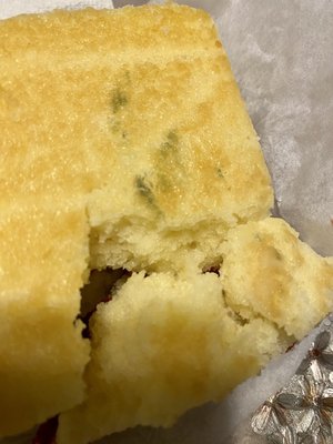 Photo of El Molino Real Bakery - Lawndale, CA, US. a piece of bread with a bite taken out of it