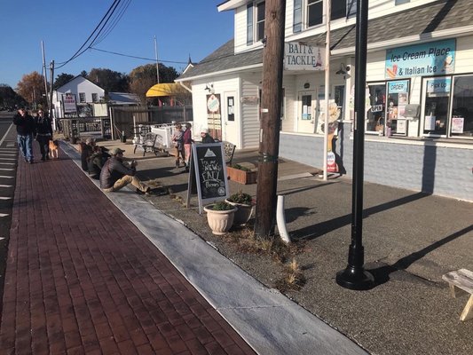 Photo of The Ice Cream Place - Solomons, MD, US. Sidewalk leading to The Ice Cream Place