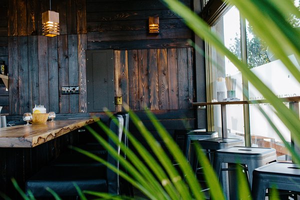 Photo of Hapa Kauai - Koloa, HI, US. a table and chairs in a restaurant