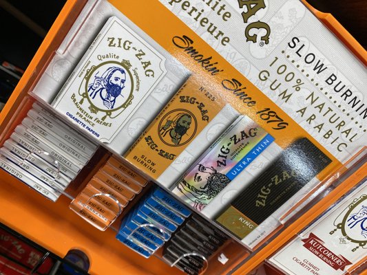 Photo of Amar Smoke Shop - West Covina, CA, US. ZIG ZANG PAPERS ZIG ZAG ORANGE ZIG ZAG ORIGINAL ROLLING PAPERS ZIG ZAG ULTRA THIN ZIG ZAG KING SIZE PAPERS ZIG ZAG KUTCORNERS