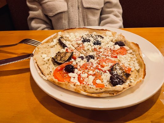 Photo of Aladdin's Eatery - Cincinnati, OH, US. a pizza on a plate