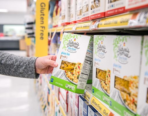 Photo of Stop & Shop - Cranston, RI, US. Tight shot of customer picking up a Nature's Promise item off the shelf.