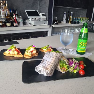 Photo of Edge Restaurant & Lounge - New York, NY, US. a table with two plates of food and a glass of water