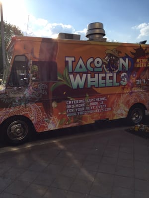 Photo of Taco On Wheels - Indianapolis, IN, US. a taco truck parked on the side of the road