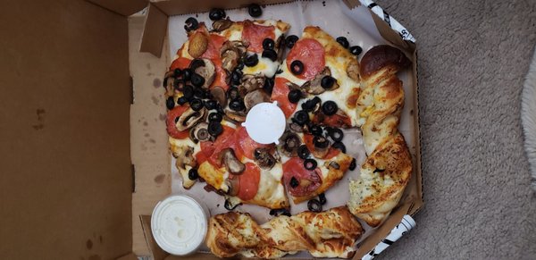 Photo of Round Table Pizza - Reno, NV, US. a pizza with olives and tomatoes