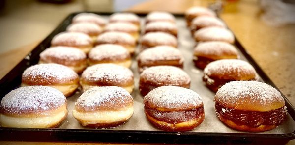 Photo of Rikopan Brazilian and Portuguese Bakery - Bridgeport, CT, US. a tray of doughnuts