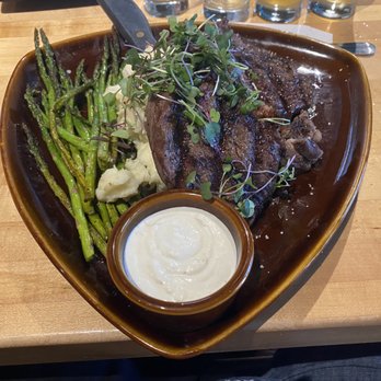 19oz ribeye steak with mashed, asparagus, and horseradish sauce.