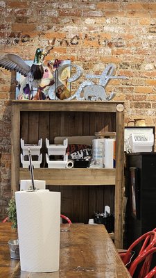 Photo of Piggybacks bbq & catfish - Lake City, SC, US. a brick wall and a wooden table