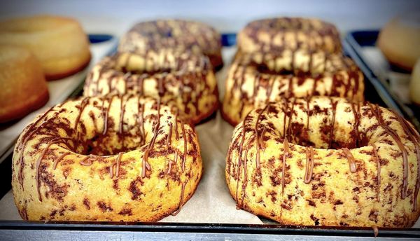 Photo of Rikopan Brazilian and Portuguese Bakery - Bridgeport, CT, US. a row of doughnuts