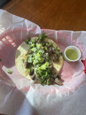 Photo of Sol Mexican Grill - Washington, DC, DC, US. Carne asada taco on corn tortilla with cilantro, onion, and salsa.