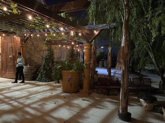 Photo of Rouge winery - Elk Grove, CA, US. a man standing under a pergol