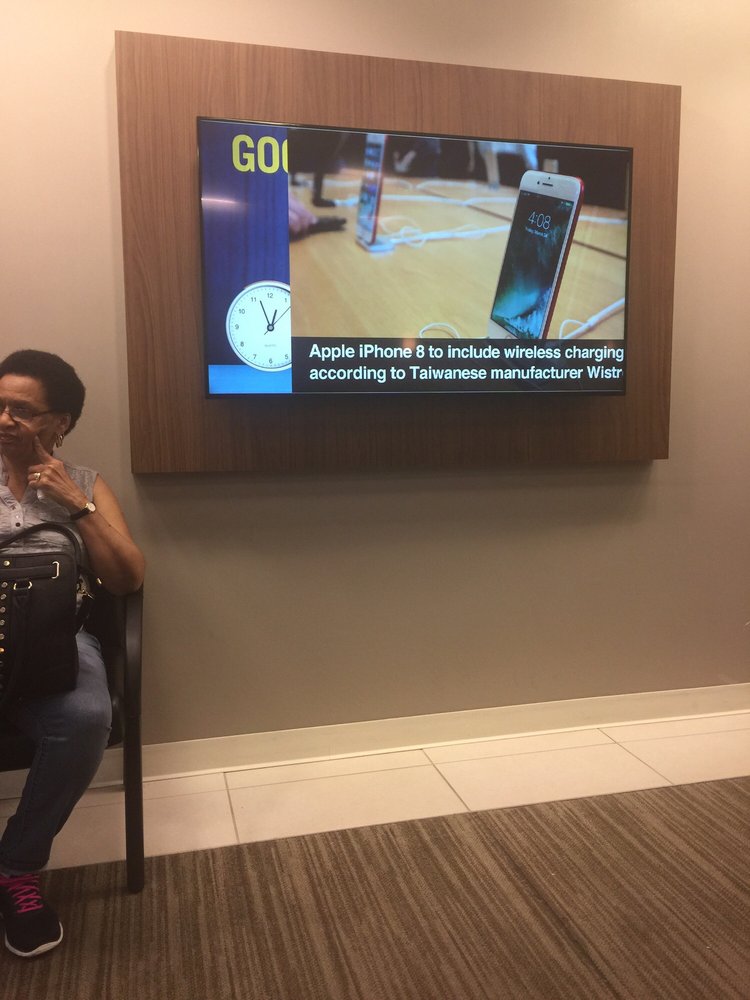 Photo of Capital One Bank - Bronx, NY, United States. Nice Seating Area with LED TV