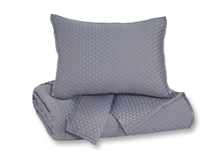 A bedding set in blue gray including a comforter and a pillow sham.