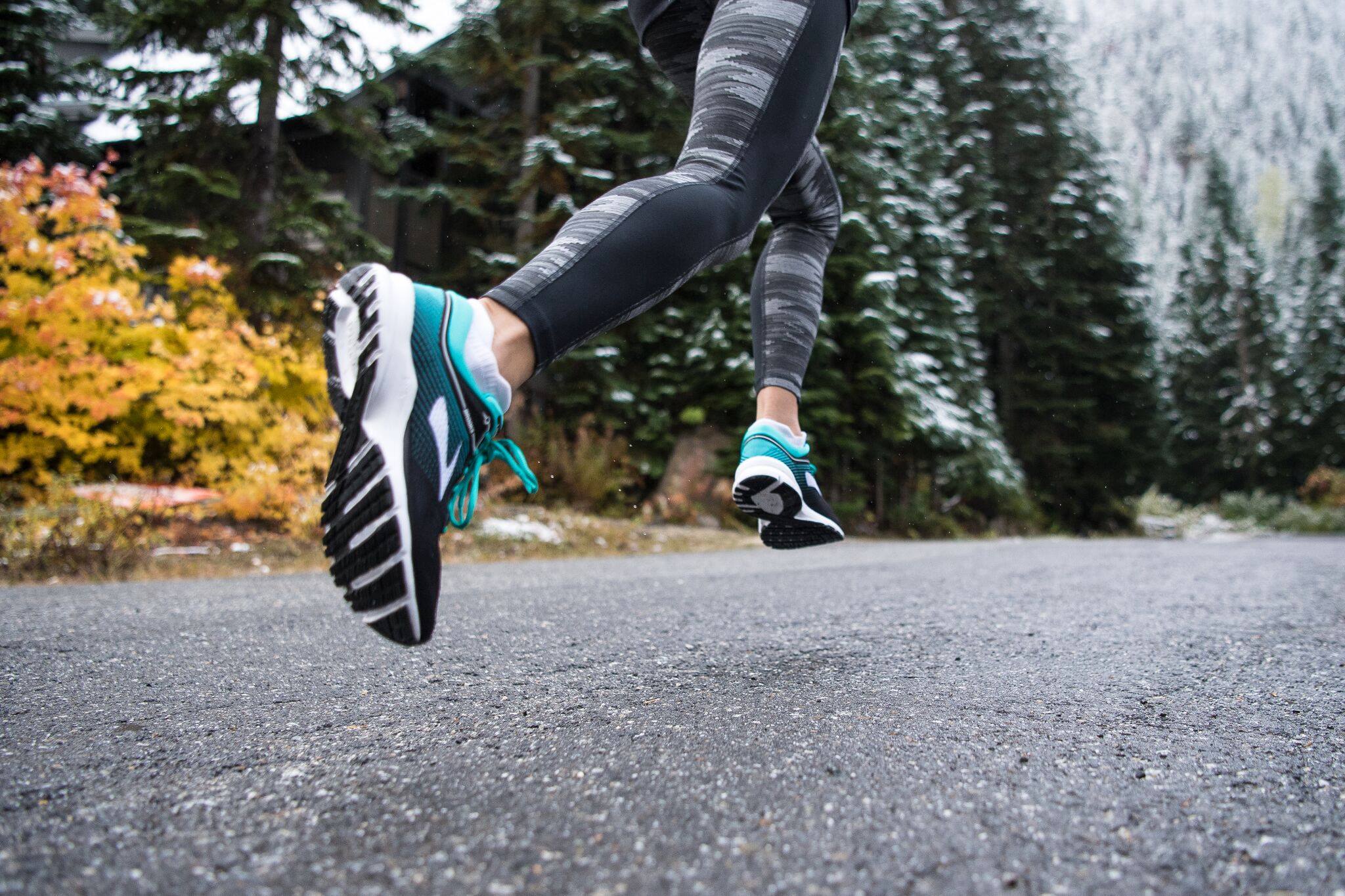 Female runner in tights and Brooks Running Shoes