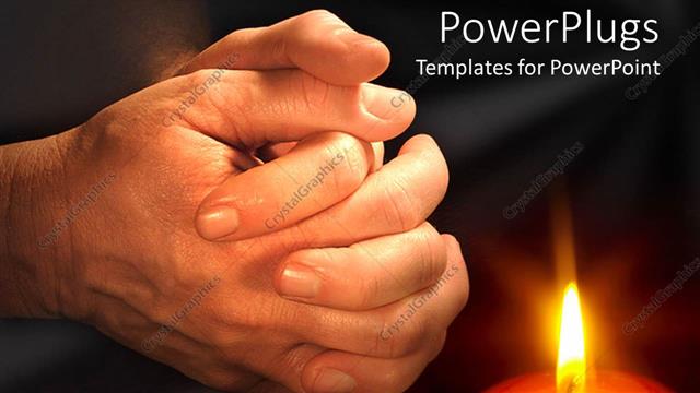 PowerPoint Template: man hands praying near burning candle light on black  background (23755)