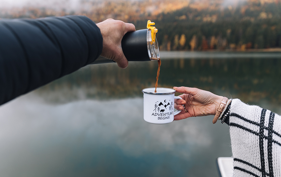 pouring coffee into camping mug