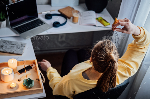 Woman on workplace with Head Massager Scalp Scratcher with Fingers. Self-massage with Head