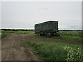 TL1790 : Farm vehicle in a flat landscape, Stilton Fen by Jonathan Thacker