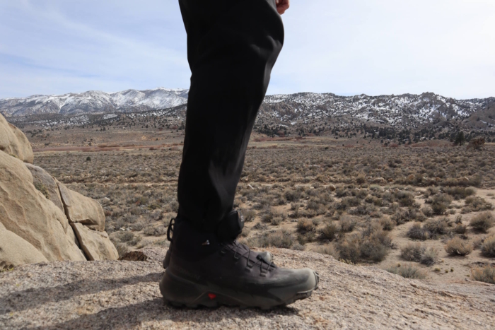 Person standing on a rocky surface wearing Cross Hike 2 Mid boots