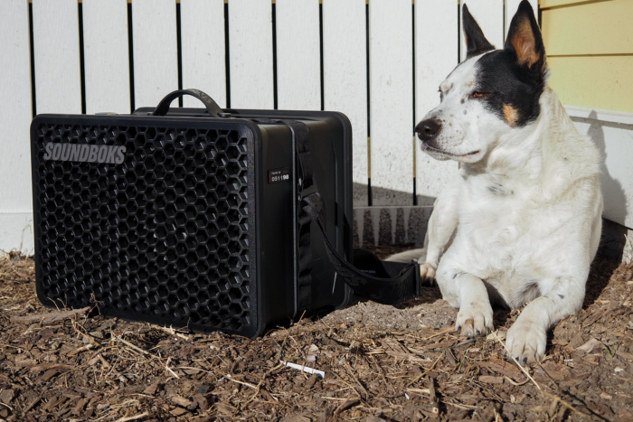 soundboks go speaker next to dog outside