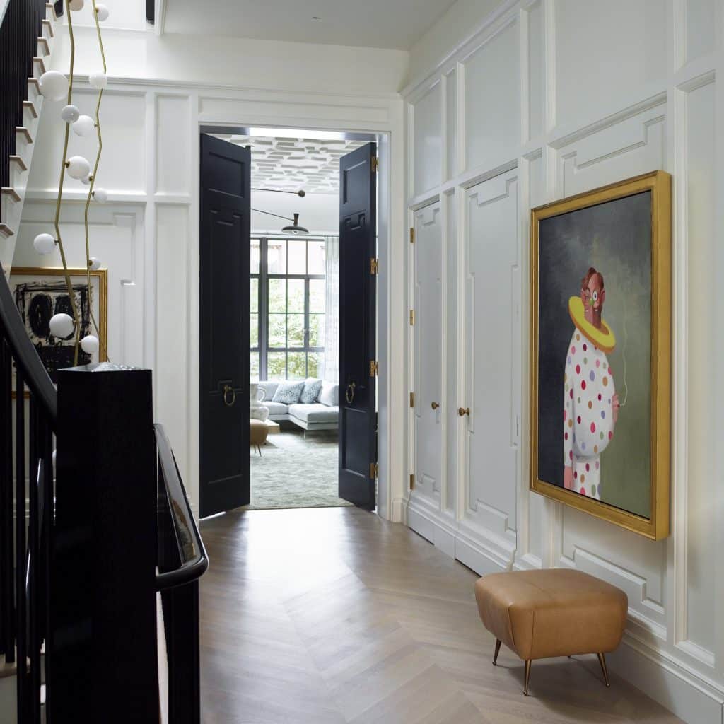 Interior designer Brad Ford West Village townhouse renovation foyer gallery entry George Condo view to living room