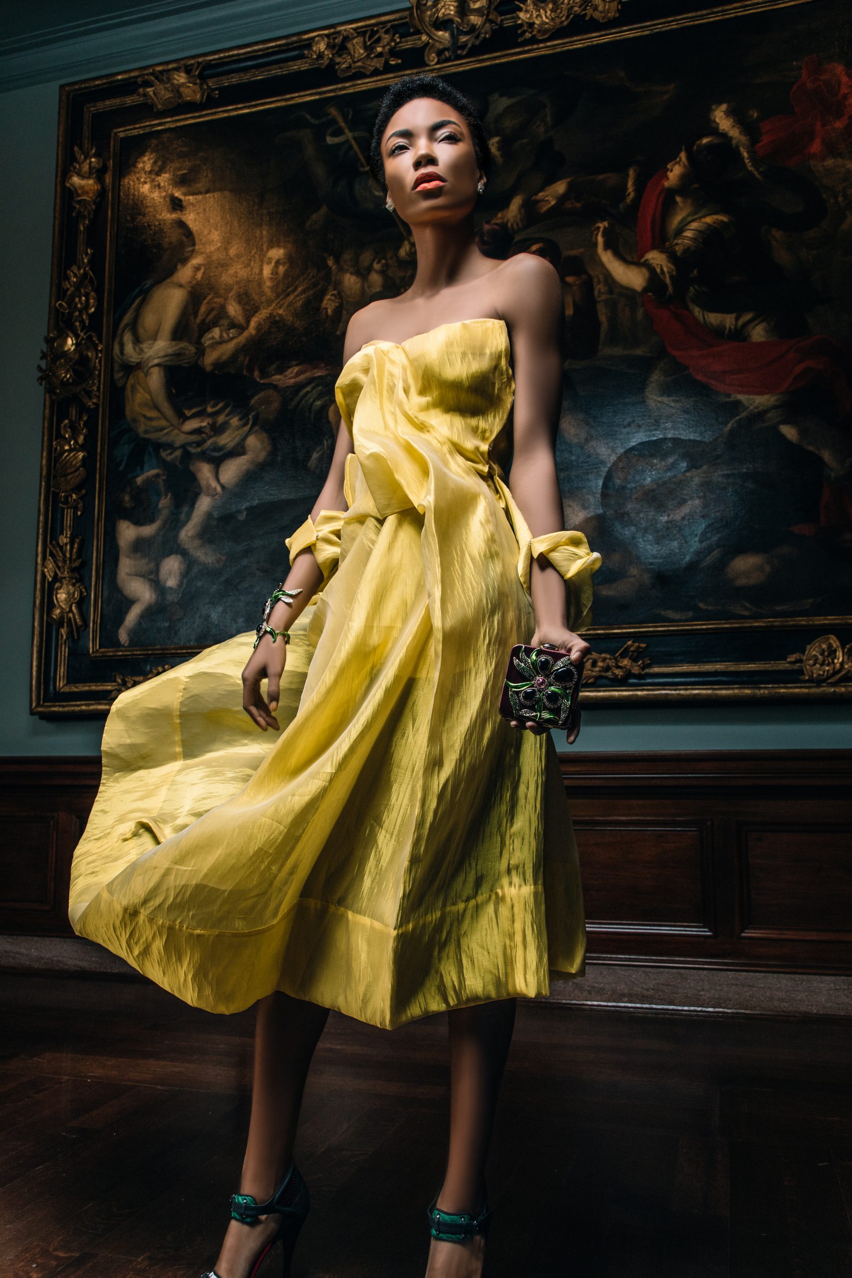 A model in a yellow YOHJI YAMAMOTO dress, sold by Evolution, at the Cincinnati Art Museum