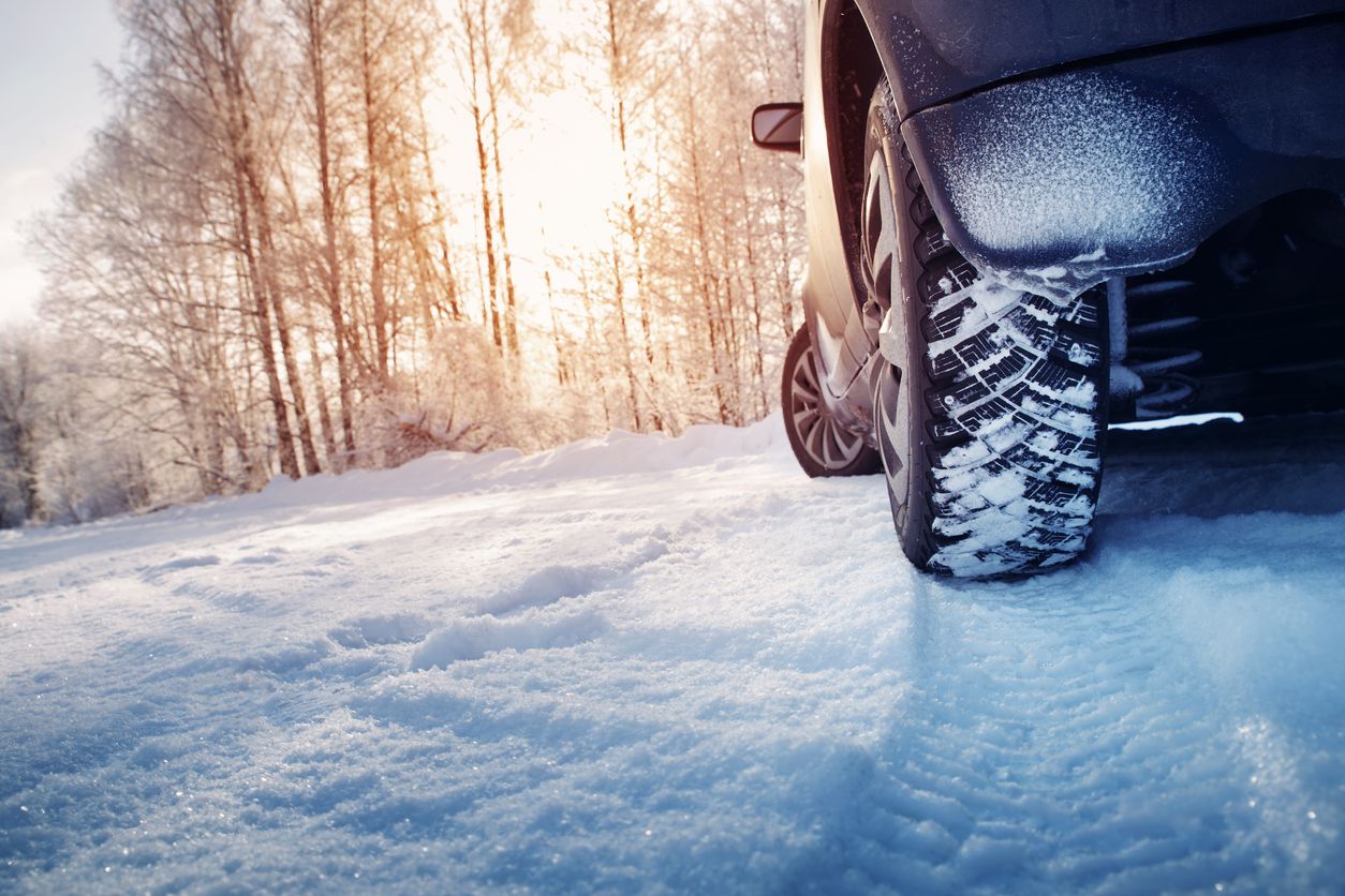 image of a car driving in the snow