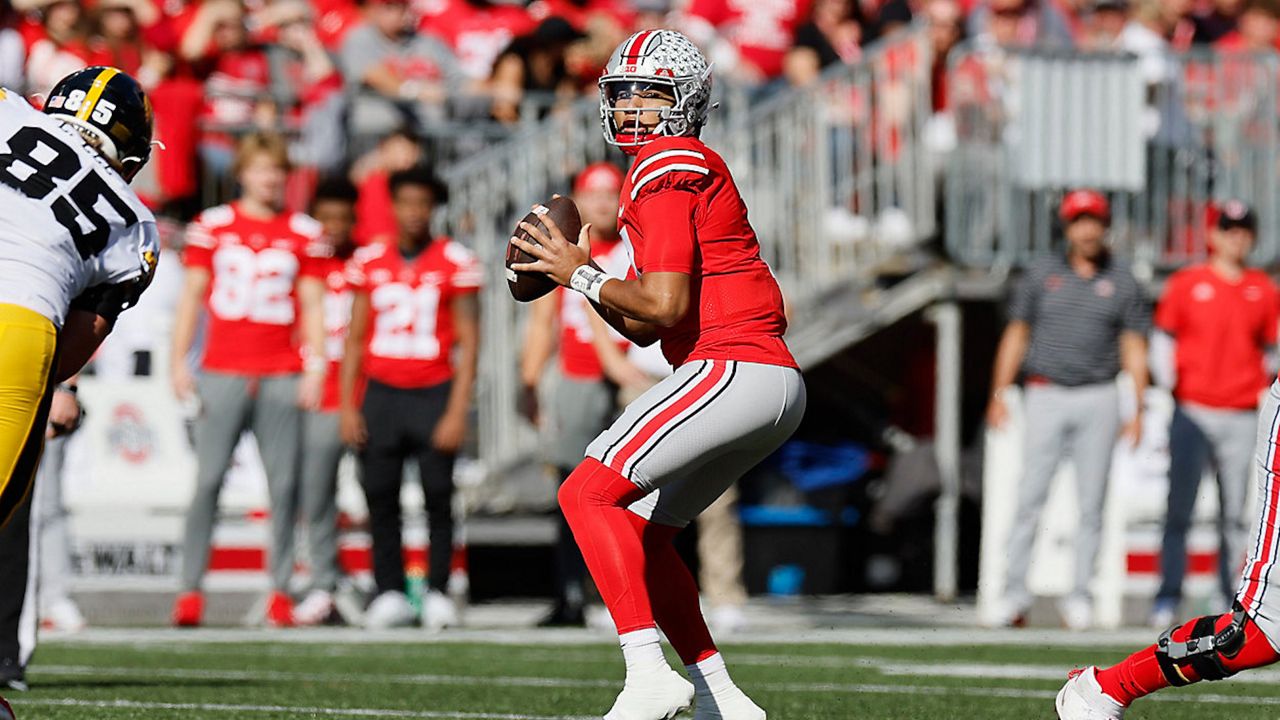 a football player in a stadium getting ready top throw