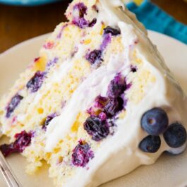 slice of lemon blueberry cake on a plate