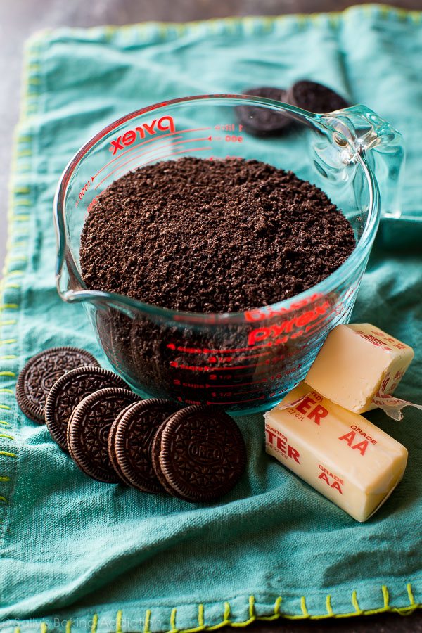 Oreo cookie crumbs in a glass measuring cup