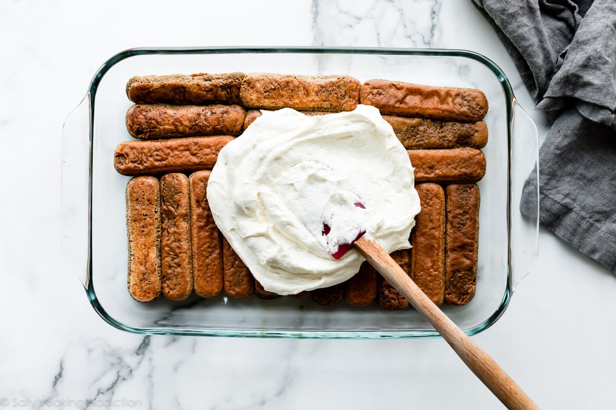 Layering tiramisu in glass dish