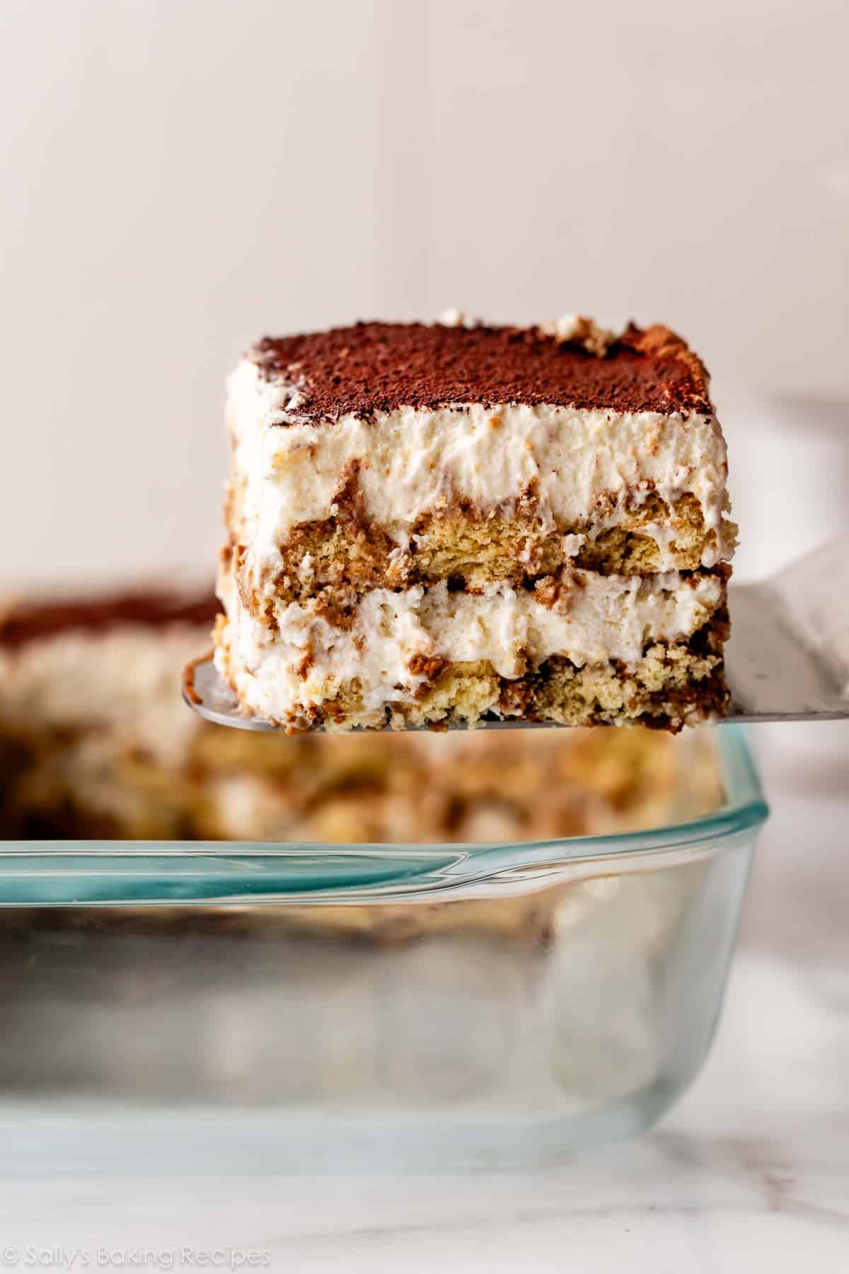 Slice of tiramisu being removed from pan.