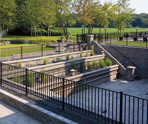 Backyard sunken patio with retaining wall with landscape