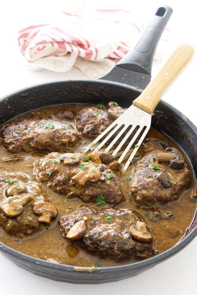 Skillet with salisbury steak in mushroom sauce