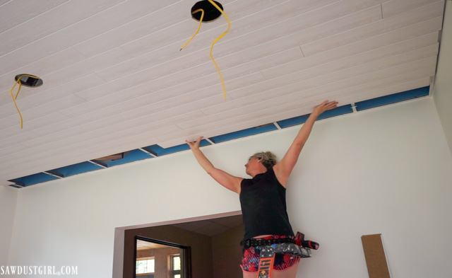 Wood planks that attach to suspended ceiling grid.