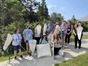 Schoodic students read to go bug collecting