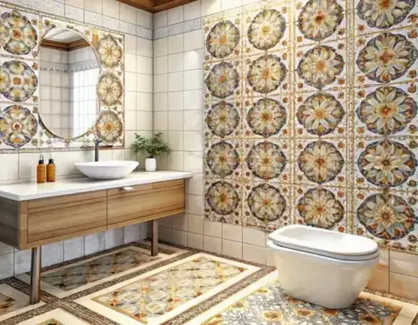 A bathroom with Moroccan tiles on the walls and floor, featuring a round mirror, white sink on a wooden vanity, and a small plant. Moroccan Tiles at SC HOME.