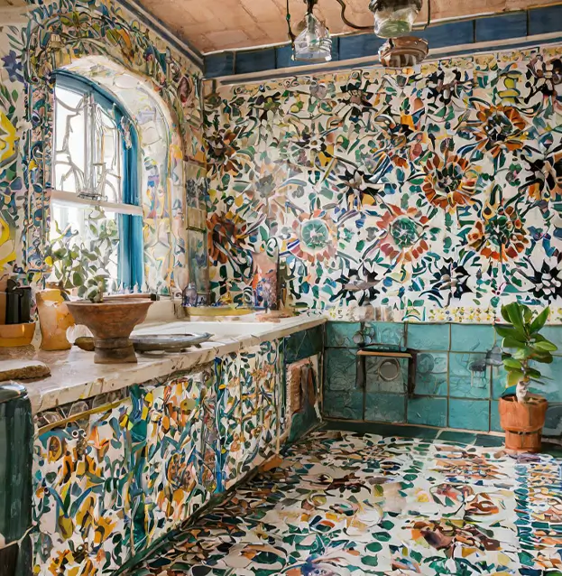 A colorful kitchen with Moroccan tiles at SC HOME, featuring floral and abstract patterns