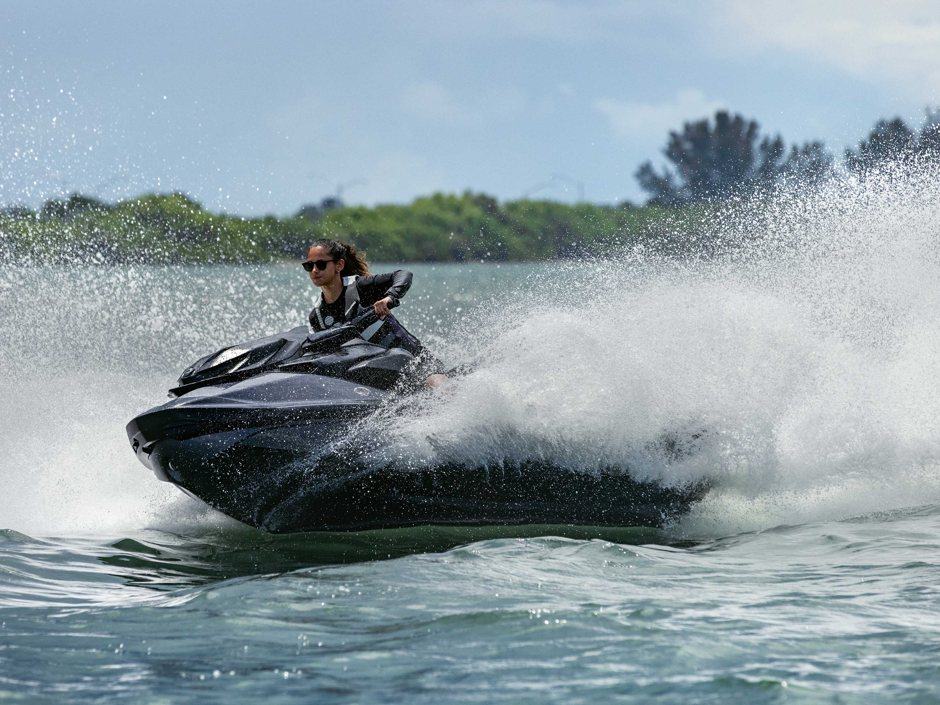 Couple riding a Sea-Doo GTI personal watercraft