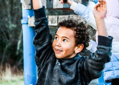 Color photo of a child playing on the playground