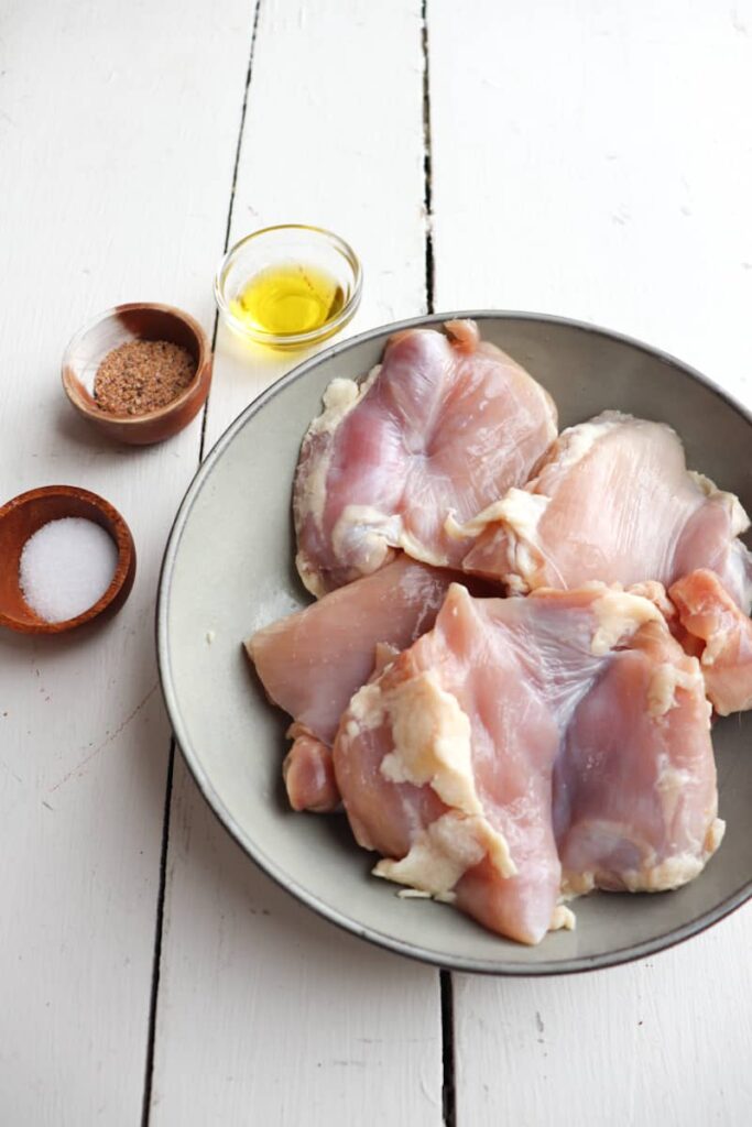 chicken thighs ingredients on a white background