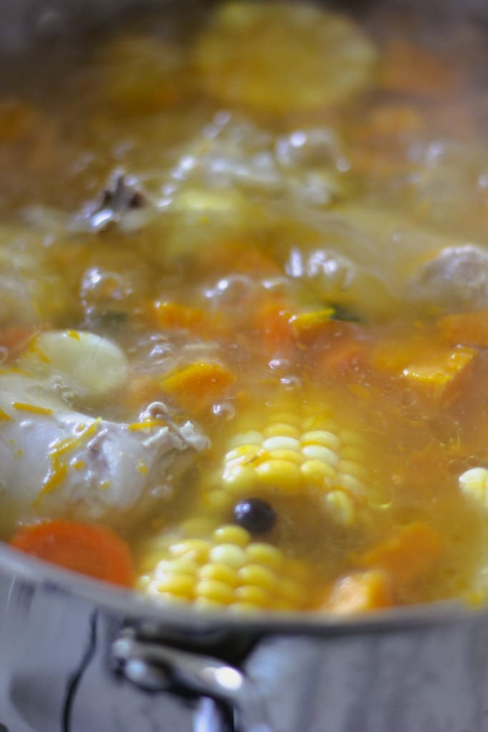 chicken pumpkin soup boiling in pot.