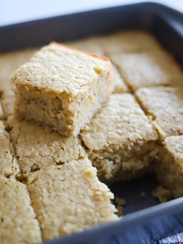 jamaican coconut cake sliced in cake pan.