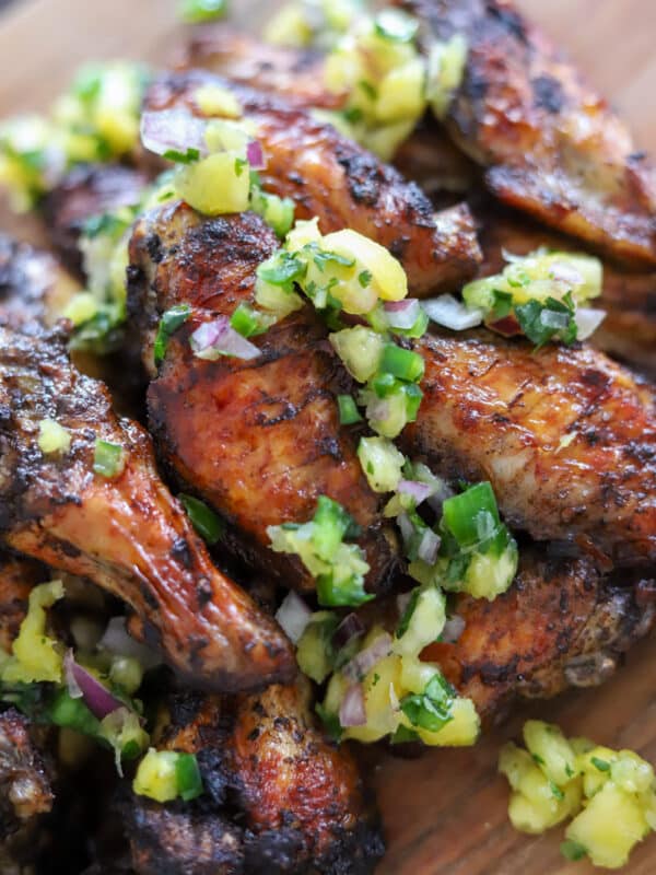 jerk chicken wings topped with pineapple sauce