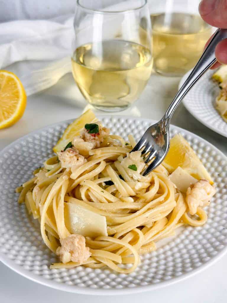 A fork twirling in lobster scampi linguine