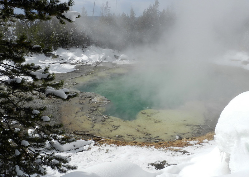 green hot spring with steam