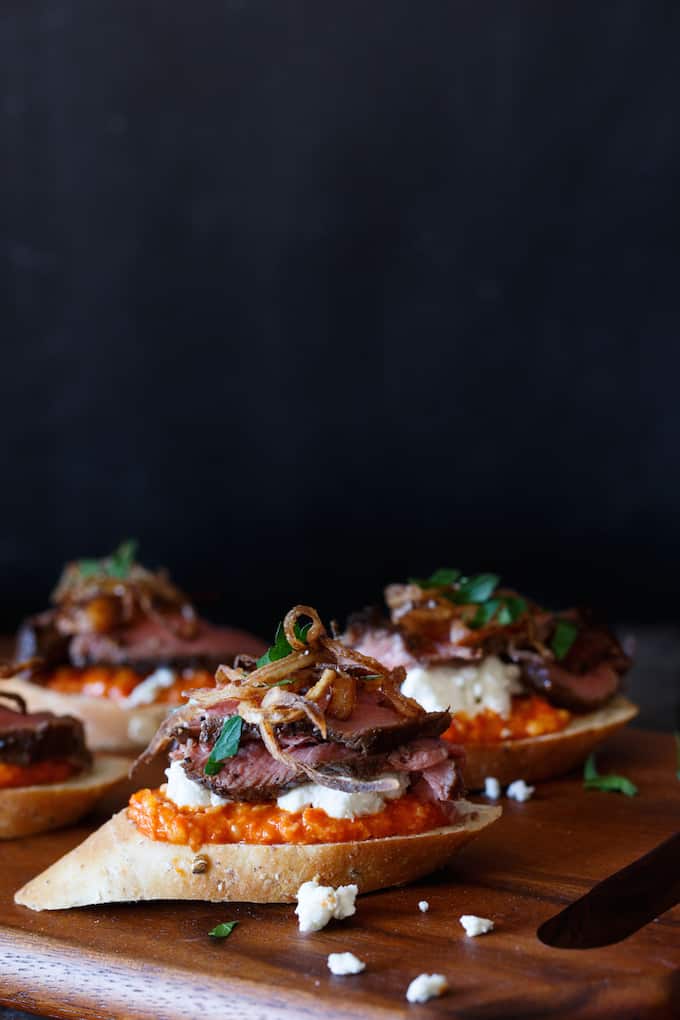 Filet Mignon Crostini with Romesco, Goat Cheese, and Crispy Shallot | sharedappetite.com