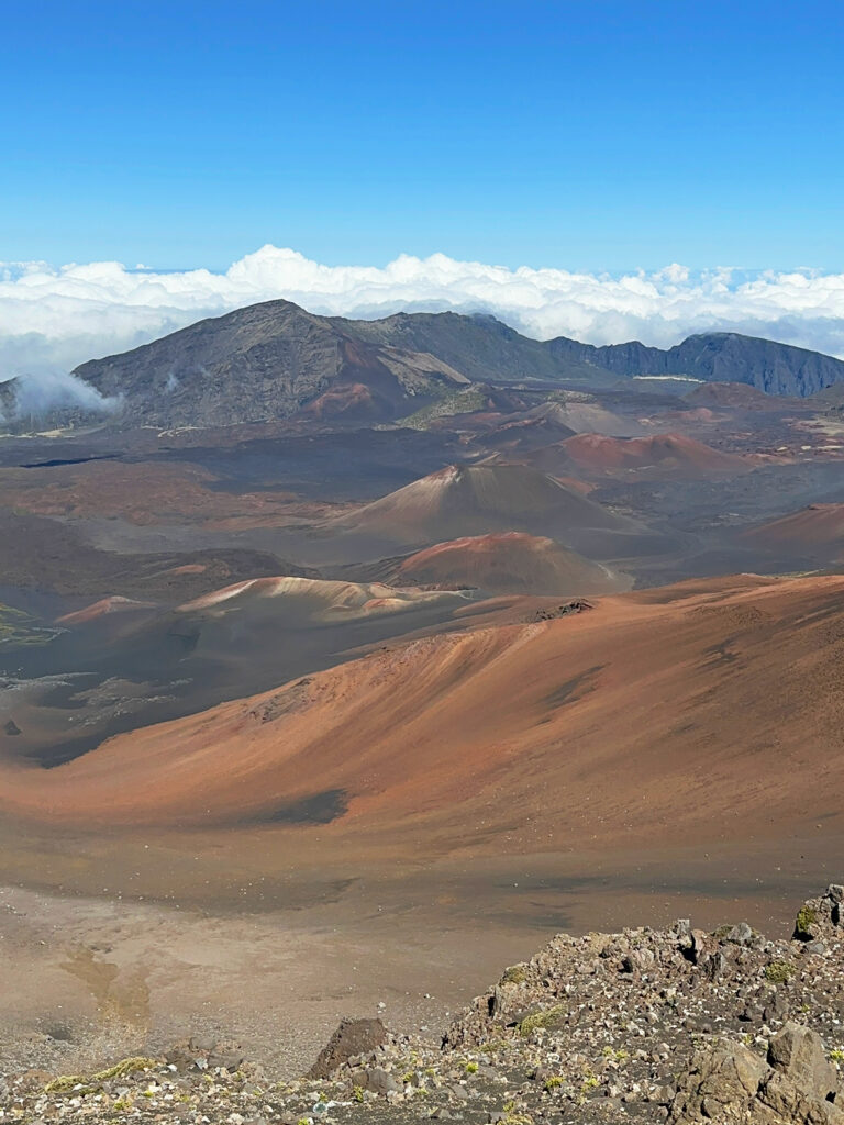 Haleakala crater with multicolored dirt and clouds